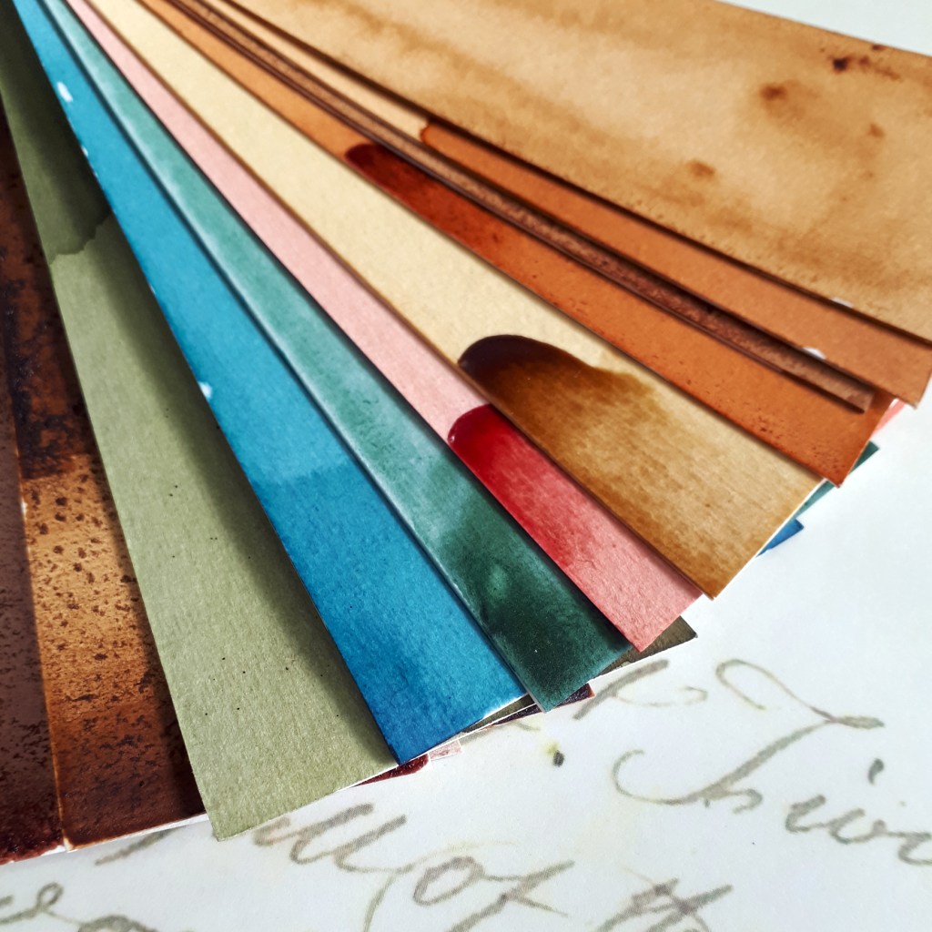 Flyer showing a range of papers covered in a colourful range of botanical inks